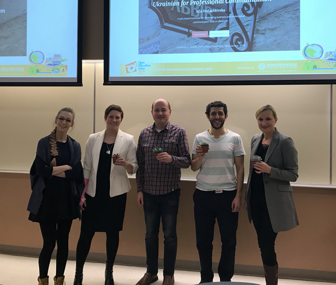 OER Winners standing in an auditorium accepting their plant awards