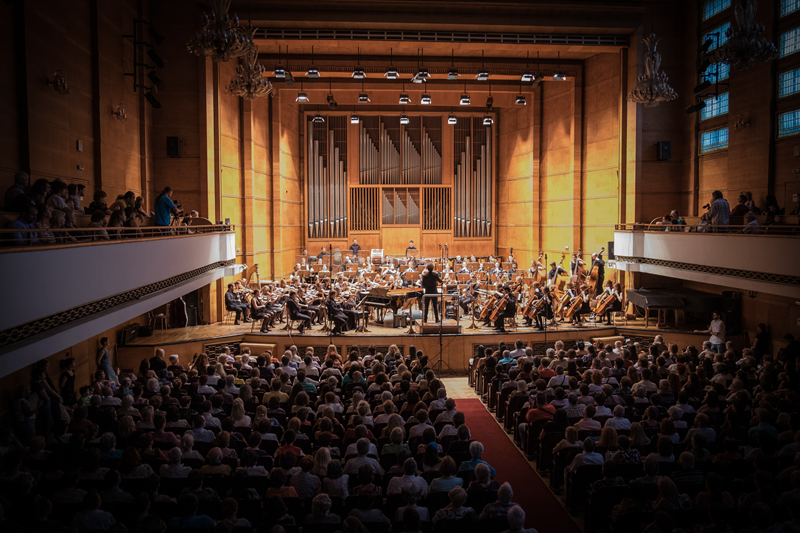 A symphony orchestra performing in a concert hall