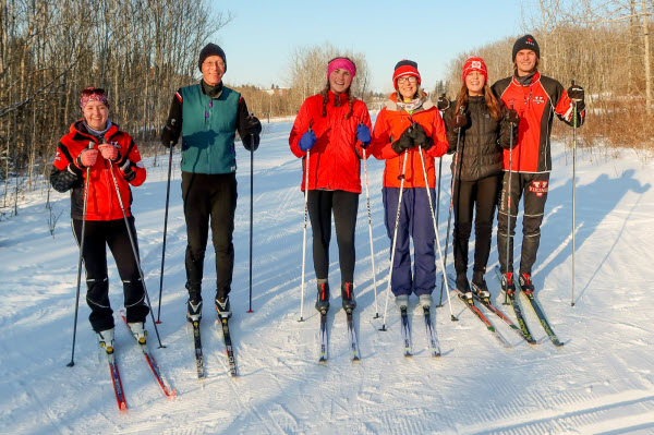 6 people in the Camrose Valley ready to head out for a cross-country ski on a bright winter day