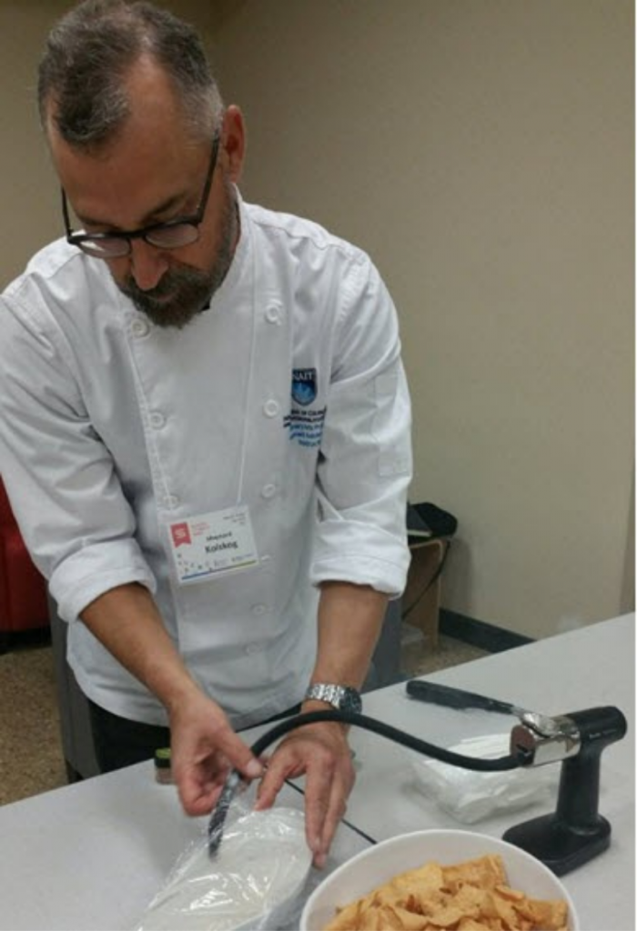 A chef is infusing food with smoke.