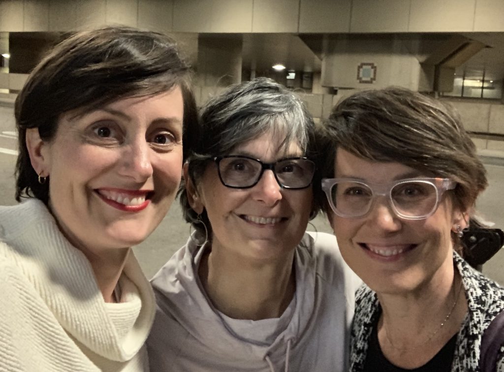 Chantelle, Trudi and Angie smile for a selfie.